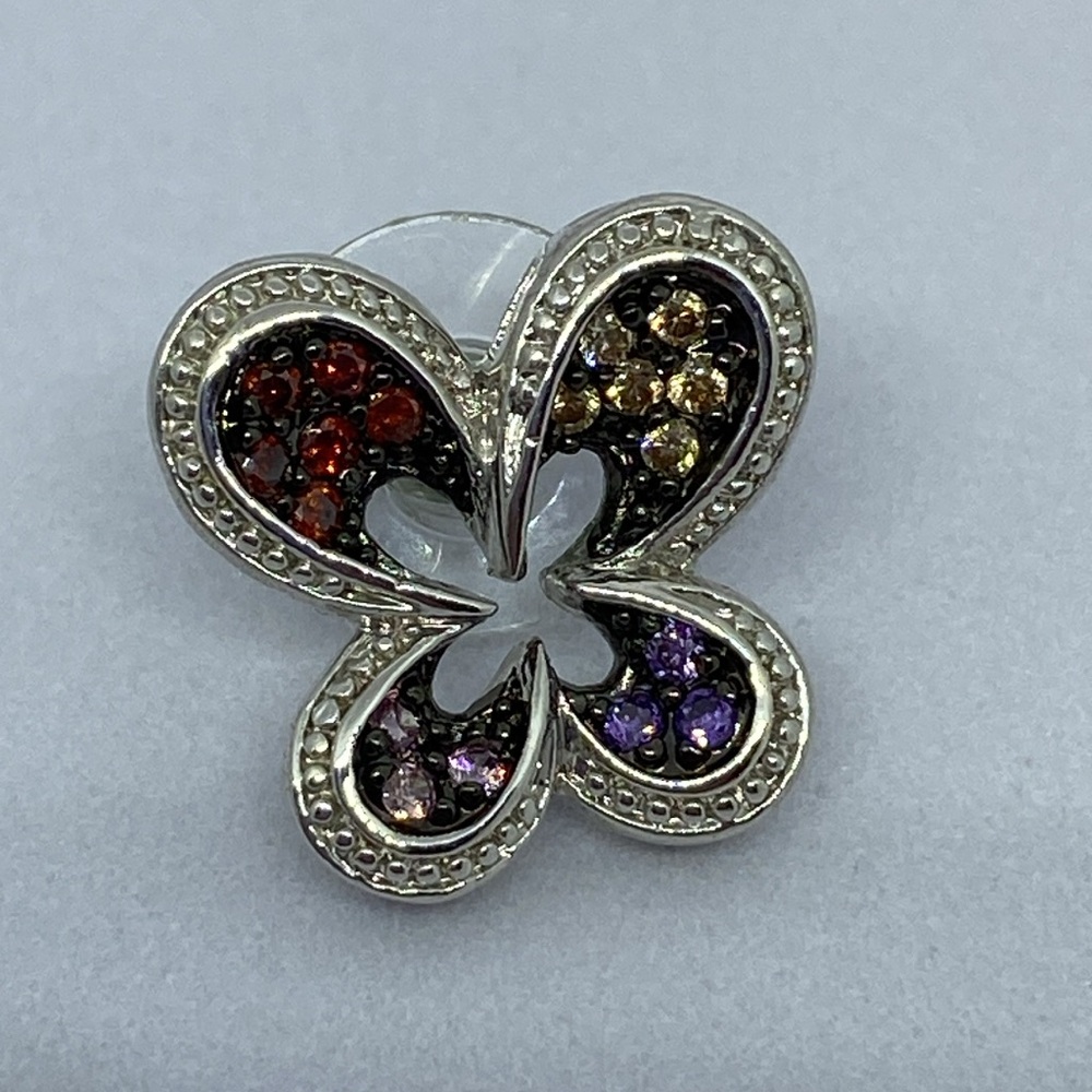Silver tone CZ pierced earrings.